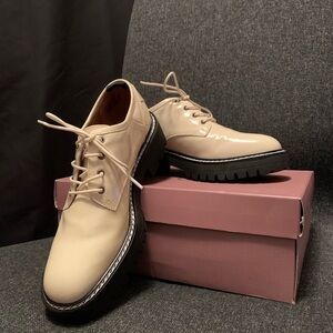 Franco Sarto Cream and Black Flats with Lace-Up Design